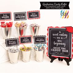 candy bar with chalkboard signs and buckets full of candies for graduation party