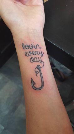 a woman's wrist tattoo with the words never you ever written in cursive writing