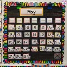 a bulletin board that has been decorated with different colors and numbers for the month of may