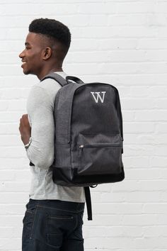 Our classic, heathered black, water resistant backpack doesn’t have to be used only as a book bag. It’s a medium size that fits comfortably on your back and the large pocket has plenty of space for books, shoes, gym clothes, a laptop, or travel clothes. For a special touch, the black backpack can be personalized with a custom embroidered name or set of monogrammed initials making it a great gift idea for any of the men or women on your list available at a cheap price. Black Laptop Bag, Water Resistant Backpack, Canvas Travel Bag, Backpack Gift, Travel Clothes, Back To School Backpacks, Weekend Travel Bags, Personalized Backpack, Embroidered Name