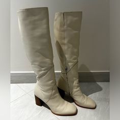 Fynn Boots By Dolce Vita. Size 10 With Wide Calf, Calf Opening 15.9”. Color Sand Nubuck. Heel Height 3”, Shaft Height 12.6”. Only Worn Once, Like New Condition. White Wide Calf Boots With Block Heel, White Heeled Boots With Padded Heel, Medium Width, White Heeled Boots With Padded Heel, Chic White Closed Toe Heeled Boots, Elegant White Round Toe Boots, Elegant White Knee-high Boots, White Knee-high Medium Width Heeled Boots, Cream Block Heel Boots For Formal Occasions, Elegant White Heeled Boots With Round Toe