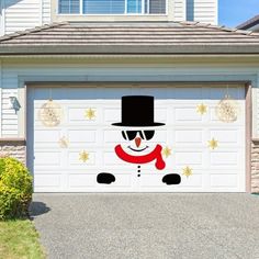 a snowman is painted on the side of a garage door