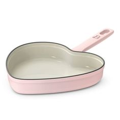 a pink pan with a spoon in it