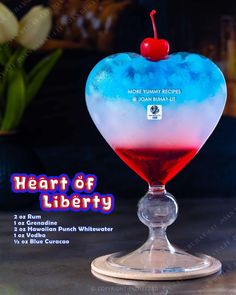 a heart shaped drink with blue and red liquid