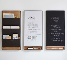 two blackboards with writing on them are next to each other in front of a white wall