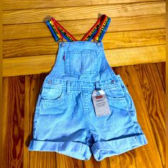 Levi’s Blue Jean Short Overalls With Adjustable Rainbow Straps, Nwt. Size Short Tall 6 Regular Blue Denim Bottoms For Playwear, Light Blue Casual Bottoms For Playtime, Casual Light Blue Bottoms For Playtime, Levi's Blue Cotton Bottoms, Jean Short Overalls, Short Overalls, Jean Short, Blue Jean Shorts, Levi Shorts