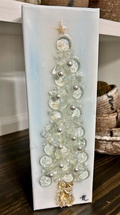 a christmas tree made out of glass beads