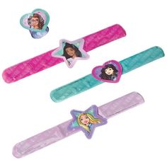 three hair clips with pictures of princesses on the top and one star in the middle