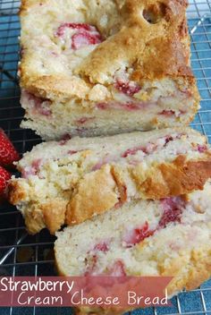 strawberry cream cheese bread on a cooling rack with fresh strawberries in the background and text overlay that reads, strawberry cream cheese bread