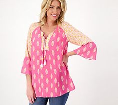 Wardrobe winner! This is the printed tunic to get you excited about your spring/summer closet. Get ready to reach for this tasseled tunic on the regular. From Susan Graver. Summer V-neck Top With Tassels, Summer V-neck Tops With Tassels, Casual Summer Tunic With Split Neck, Casual Boho Print Tunic Top, Casual V-neck Tops With Tassel Ties, Spring Beach Tunic With Split Neck, Casual Vacation Blouse With Tassel Ties, Casual Tunic Top With Tassels, Casual Blouse With Tassel Ties For Vacation