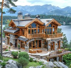 a large wooden house sitting on top of a lush green hillside next to a lake