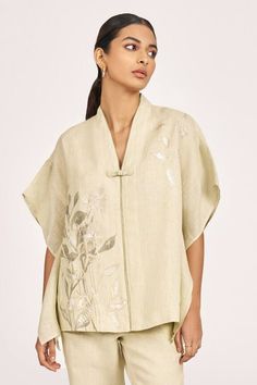 Green tea kaftan top with hand-embroidered leaves using anchor thread embroidery, stroked with light and dull shades of gold. Paired with a matching straight pant. - Aza Fashions Traditional Linen Tops For Spring, Elegant Embroidered Tops With Relaxed Fit, Embroidered Beige Linen Top, Beige Embroidered Linen Top, Beige Linen Tops With Floral Embroidery, Elegant Linen Tops With Floral Embroidery, Spring Linen Tunic With Embroidery, Traditional Tops With Kimono Sleeves For Spring, Anchor Thread Embroidery