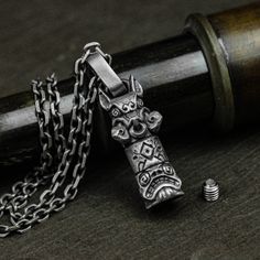 Material: 925 silver, brass Size: 14mm*35mm (thick) Weight: Brass: about 20g                  Silver: about 24g  ◆This is a handmade pig totem pole urn pendant. Each item is customized and will have a special meaning for you. How special your loved ones are to you and how sad it is when they leave us. This necklace includes a hollow urn pendant to house the cremated ashes of your loved one for lasting remembrance and companionship. ◆Unscrew the screw cap of the round ring at the top, fill it wit Carved Silver Brass Jewelry, Silver Carved Brass Jewelry, Spiritual Stainless Steel Locket Jewelry, Unique Engraved Stainless Steel Necklaces, Sterling Silver Amulet Necklace With Carved Details, Hair Locket, Ash Hair, Pet Keepsake, Urn Pendant