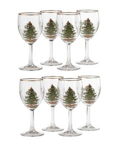 six wine glasses with pine trees painted on them