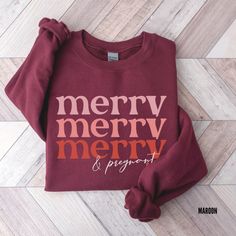 Christmas Pregnancy Announcement Sweater, Merry and Pregnant Sweatshirt, Baby Reveal Shirt, Pregnant Christmas Sweater, Baby Announcement GILDAN 18000 - Unisex heavy blend crew neck sweatshirt - Pre-Shrunk 50% Cotton/50% Polyester made with softer air-jet spun yarn - Size chart can be found on listing photos - Unisex fit, runs true to size - Colors may vary slightly due to your monitor settings PRINTING TECHNIQUE -DTG or Direct-to-garment is a printing method that sprays the ink onto the garment Christmas Pregnant Shirt, Pregnant Christmas Shirt, Pregnancy Announcement Christmas Gift, Christmas Pregnancy Announcement Shirt, Christmas Maternity Shirt, Baby Reveal Shirt, Funny Pregnancy Announcement