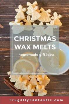 homemade christmas wax melts with orange slices and cinnamon sticks on a wooden table next to a cup of tea