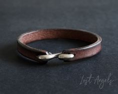 **NOTE: This item is available in TWO sizes. PLEASE ORDER THE MOST SUITABLE SIZE FOR YOUR WRIST** 100% Genuine leather brown band bracelet with a hook clasp.  Stylish design to complement both casual and smart outfits. Material: Genuine Leather. Steel Hook clasp. 20 cm OR 21.5cm Length Model wears 21.5cm. (Tip - Gents consider a 21.5cm, Ladies the 20cm) This item comes complete with a gift pouch. Leather Mens Bracelet, Leather Bracelet Tutorial, Smart Outfits, Bracelet Crochet, Stainless Steel Bracelet Men, Mens Valentines Gifts, Beaded Leather Bracelet, Mens Bracelet Silver, Bracelet Leather