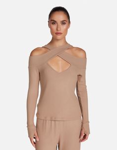 Made in LA 62% Rayon 23% Poly 13% Cotton 2% Spandex Machine Wash Cold, Lay Flat to Dry ML Signature Soft Knit Fabric Cold Shoulder Styling Thumbhole Cutouts Front Cutout Detail Brushed Finishing Banded Trim Model & Fit Info Fits True to Size Modeled in Size S Height: 5' 10" / Waist: 24" / Bust: 32" / Hips: 35" Chic Stretch Knit Top For Loungewear, Stretch Fine Knit Top For Loungewear, Cold Shoulder Styles, Soft Clothes, Sand Dunes, Model Fits, Thumb Holes, Soft Knits, Lay Flat