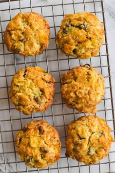 freshly baked muffins cooling on a wire rack, ready to be eaten for breakfast