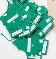 several green tags that have been placed on top of each other