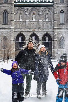 a group of people standing in the snow