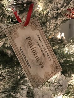 an ornament hanging from the top of a christmas tree