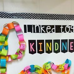 a bulletin board with colorful bracelets on it and the words linked to you kind of