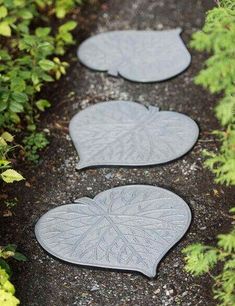 three leaf shaped stepping stones on the ground