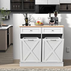 a kitchen with white cabinetry and wooden counter tops in front of a stove top oven