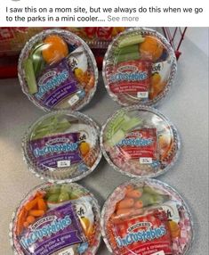 four plastic bowls filled with different types of vegetables