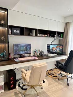 a home office with two computer monitors and a chair in front of the desk area