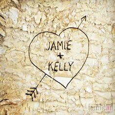 a heart with an arrow drawn on it and the words jamie kelly written in black ink