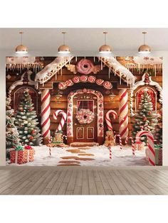 a christmas scene with gingerbreads and candy canes on the wall in front of a house