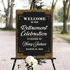 a welcome sign for a retirement celebration with white flowers on the bottom and gold frame