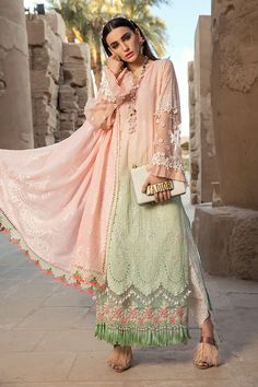 The new party and festive wear collection is all set to grab your attention with formal eid dresses. You can buy lavish fancy wear online to adorn your special event look in an elegant way. Shirt: This lavish festive attire is showing its grace with elegant pink and green color embroidered panels for shirt. Chiffon shirt is embellished with schiffli embroidered front and printed back panel. Neck is designed with lawn embroidered neckline. Schiffli embroidered sleeves are designed with beautiful Maria B Lawn, Pakistani Street Style, Pakistani Fashion Casual, Eid Dresses, Maria B, Lawn Suits, Embroidered Neckline, Pakistani Dress Design, Embroidery Suits