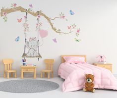 a child's bedroom decorated in pastel pink and white with a swing bed