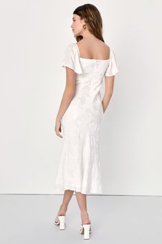 If you've got garden parties and summer soirees on your mind (and your calendar!), you'll find a perfect match in the Lulus Effervescent Afternoon White Satin Flutter Sleeve Midi Dress! Sleek satin jacquard, wit a floral motif throughout, shapes this event-ready dress that has a bustier-inspired bodice and short flutter sleeves (with elastic at the shoulders). Figure-skimming skirt creates a flattering silhouette as it falls to a midi hem. Hidden zipper/clasp at back. cal Fit: This garment fits true to size. Length: Mid-calf length. Size medium measures 48" from shoulder to hem. Bust: Great for any cup size. Waist: Fitted - very fitted at natural waist. Hip: Loosely Fitted. Undergarments: May be worn with a strapless bra, adhesive bra, petals, or no bra. Fabric: Fabric has no stretch. Line White Satin Midi Dress, Midi Dress Satin, Dress With Flutter Sleeves, Picnic Wedding, Lulu Fashion, Summer Soiree, Adhesive Bra, Garden Parties, Jacquard Dress