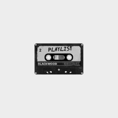 an old black and white cassette with the words playlist on it's side