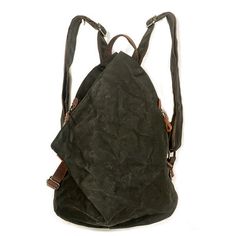 a black backpack sitting on top of a white wall