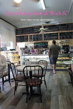 people sitting at tables in a restaurant with menus on the wall