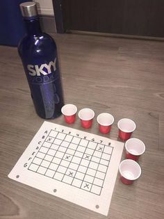 the game is set up on the floor with cups