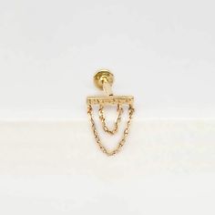 Add a touch of edge to your earring wardrobe with this 14K gold double chain cartilage earring. Perfectly suited for helix, lobe, and conch piercings, this luxe gold bar is attached to a chic double chain and finished with our secure screw in flatback post. It's a must-have for any earring connoisseur! This 14k cartilage stud looks great in an earring stack mixed with our other flat back studs ( https://www.etsy.com/shop/TwoofMost?ref=shop_sugg§ion_id=33375931 ) , or in combination with items fr Minimalist Yellow Gold-plated Piercings, Dainty Yellow Gold Cartilage Earrings With Adjustable Chain, Minimalist Yellow Gold Dangle Cartilage Earrings, 14k Yellow Gold Dangle Cartilage Earrings, Gold Minimalist Cartilage Earrings With Delicate Chain, Minimalist Gold Cartilage Earrings With Delicate Chain, Gold Cartilage Earrings With Adjustable Chain For Everyday, Lingot D'or, Conch Piercings