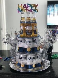 a three tiered cake made out of beer bottles