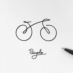 a drawing of a bicycle on top of a piece of paper next to a pen