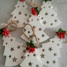 white christmas tree ornaments with red berries and twine