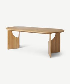 an oval wooden table with curved legs