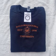 Halloweentown University Embroidered Crewneck Sweatshirt Perfect for a halloween or fall lover :)  Made to order and embroidered by me! Halloweentown University, Pumpkin Sweatshirts, University Sweatshirts, Halloween Sweater, Embroidered Tee, Embroidered Crewneck, Brand Me, Embroidered Hoodie, Halloween Town