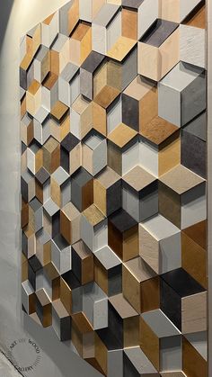 an abstract painting made up of wooden blocks