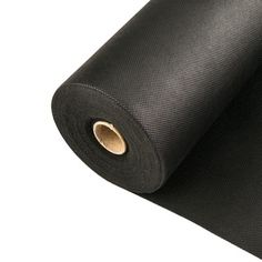 black yoga mat rolled up on white background