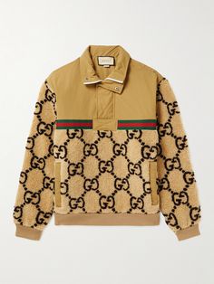 Gucci's jacket nods heavily towards old-school sportswear. It's made from shell and wool-blend fleece that's jacquard-woven with the house's 'GG' monogram. Wear yours with retro sneaks and the matching sweatpants. Gucci Long Sleeve Track Jacket For Winter, Gucci Casual Track Jacket For Winter, Gucci Long Sleeve Track Jacket For Fall, Gucci Casual Winter Track Jacket, Gucci Brown Winter Outerwear, Gucci Long Sleeve Winter Sweatshirt, Casual Gucci Winter Track Jacket, Brown Gucci Winter Outerwear, Casual Long Sleeve Gucci Track Jacket